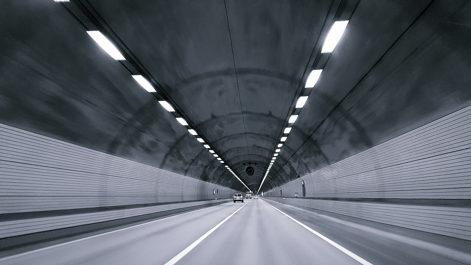time lapse photography of vehicle under tunnel